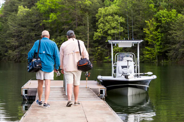 two men walking to fishing boat