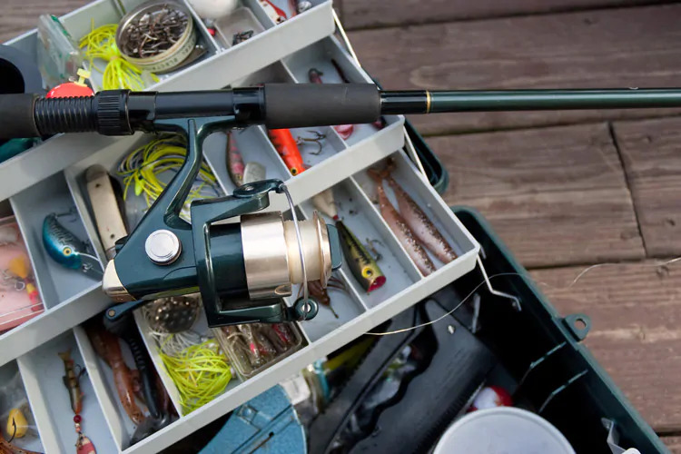 fishing rod on tackle box