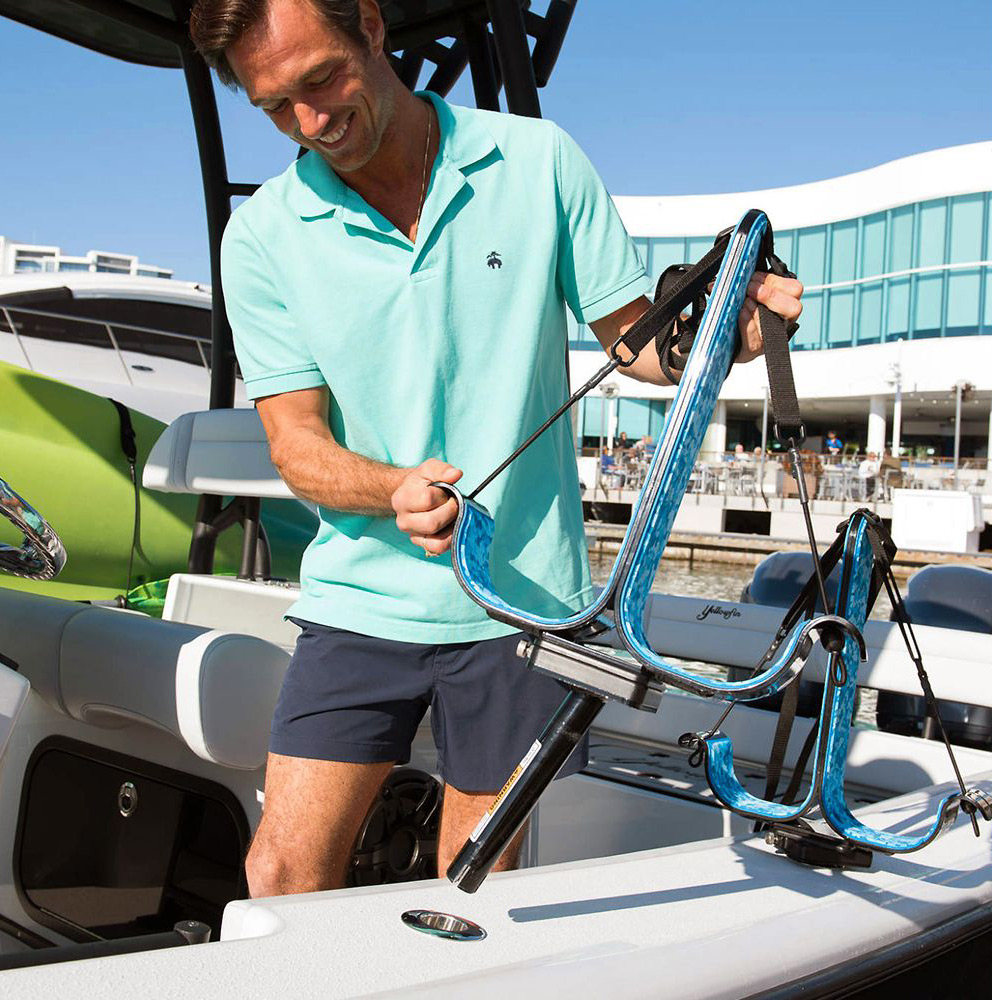 man installing manta racks on fishing boat