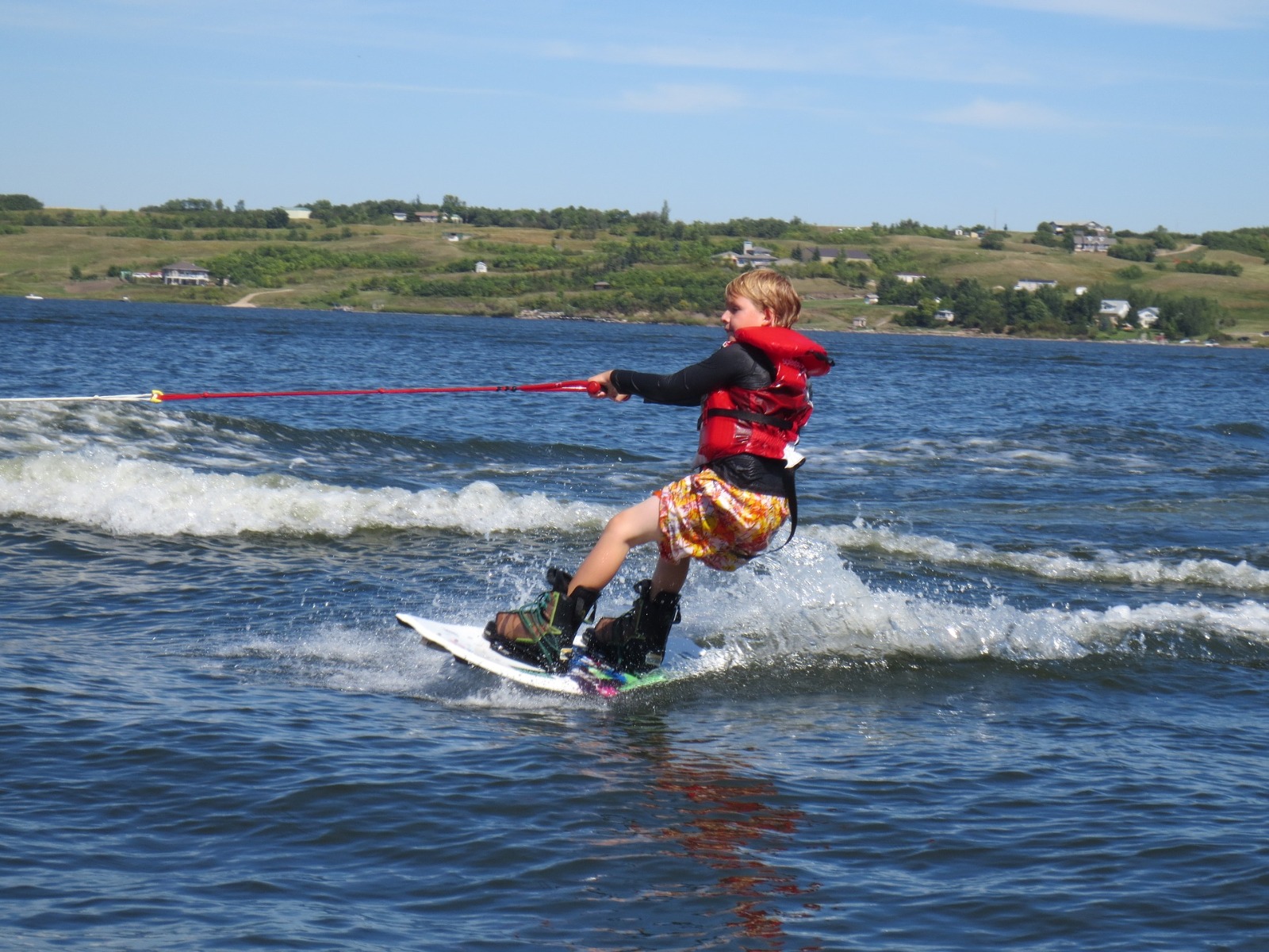 young boy wakeboarding