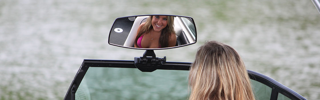 woman reflected in monster tower wakeboard mirror