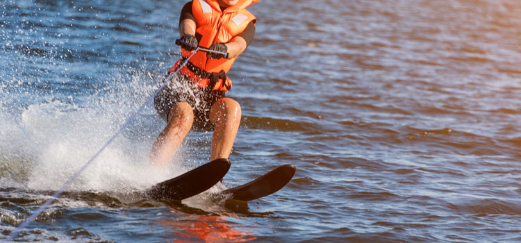 woman water skiing behind a boat