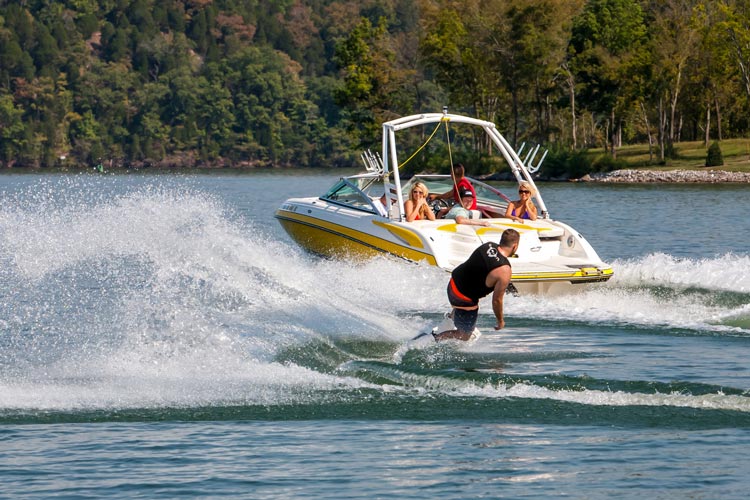 wakeboarder behind boat with mtk wakeboard tower