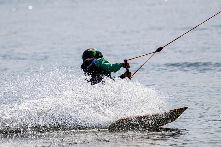 wakeboarder being pulled across water