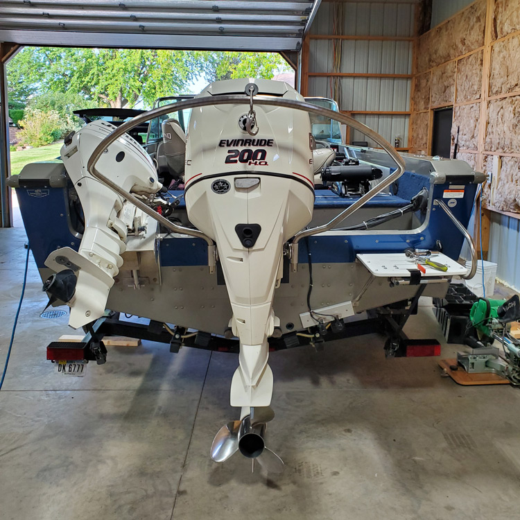 turboswing tow bar installed beside a kicker motor on a boat