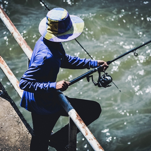 man fishing from dock